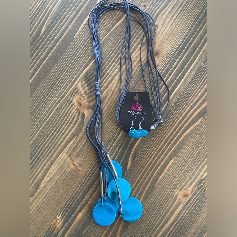 This is a long cord, blue shell, necklace with earrings, lead and nickel free